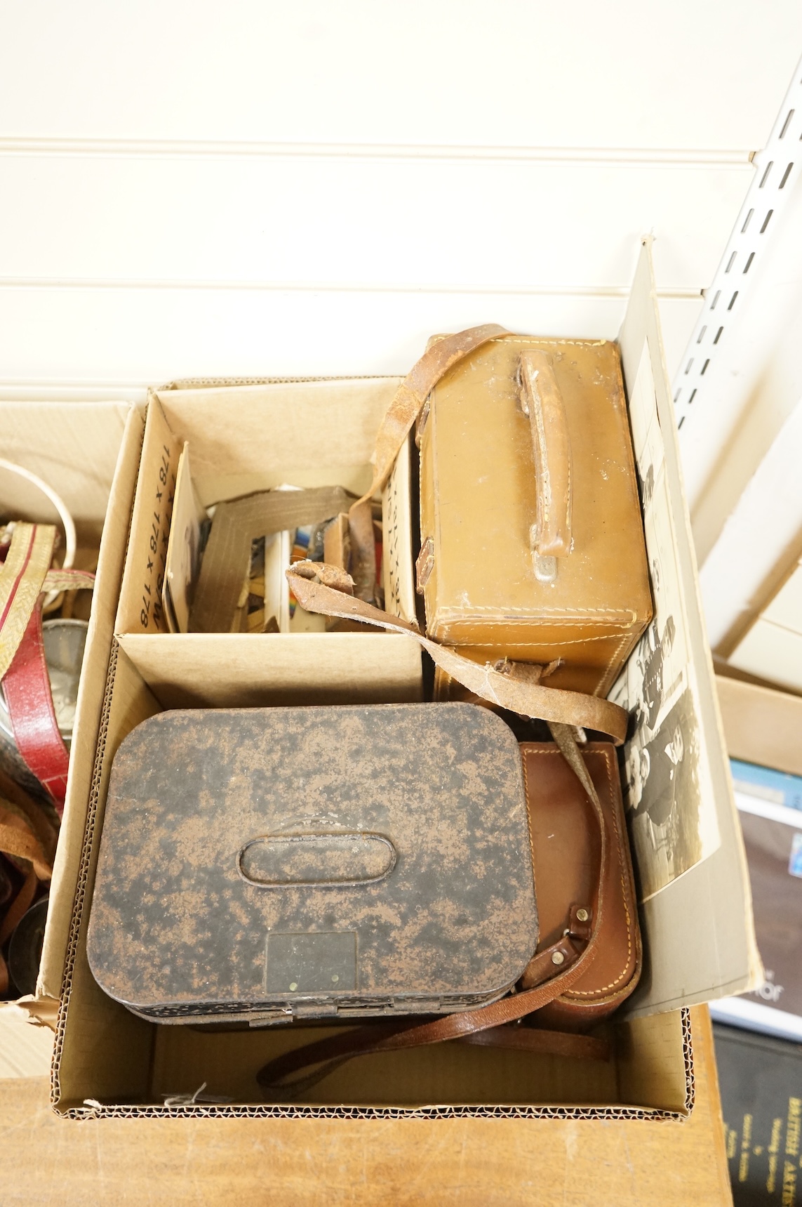 A collection of militaria including; a US Air Force camera Type N-6, a leather cased Bell & Howell Sportster camera and accessories, a pair of periscope binoculars, a leather cased compass by Goerz, Berlin